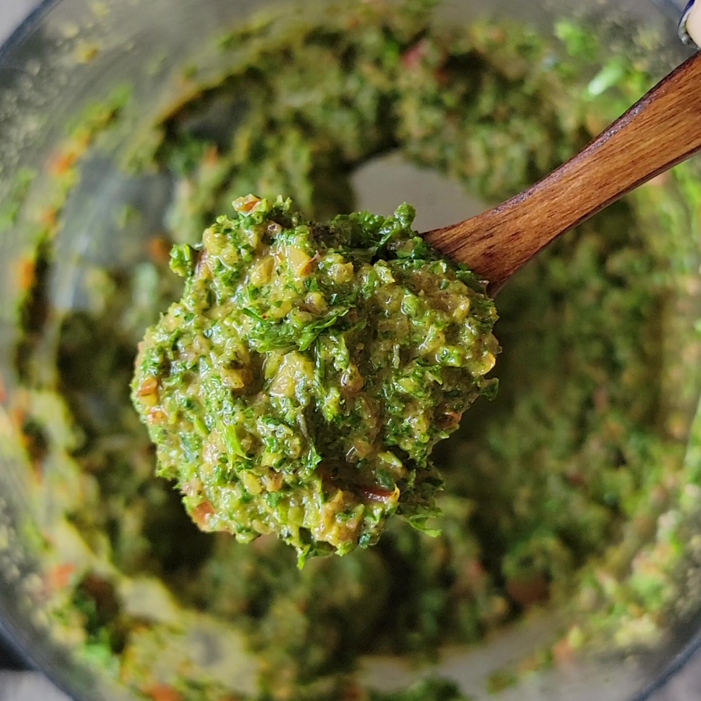 This is a closeup of the garden fresh pesto showing all the herbacious herbs.