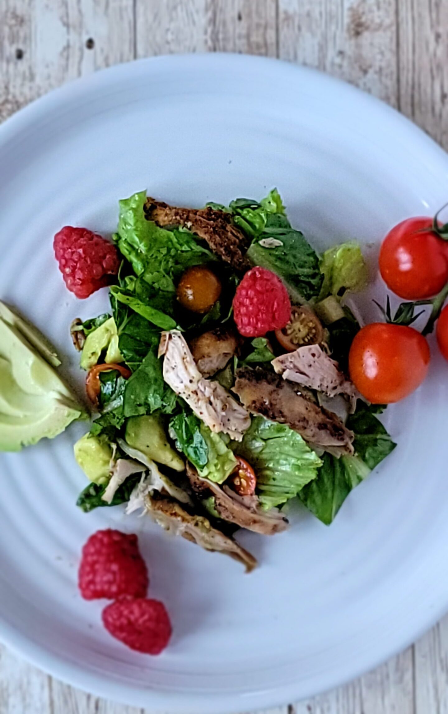 Grilled Chicken and Raspberry Syrup Vinaigrette Salad with raspberries
