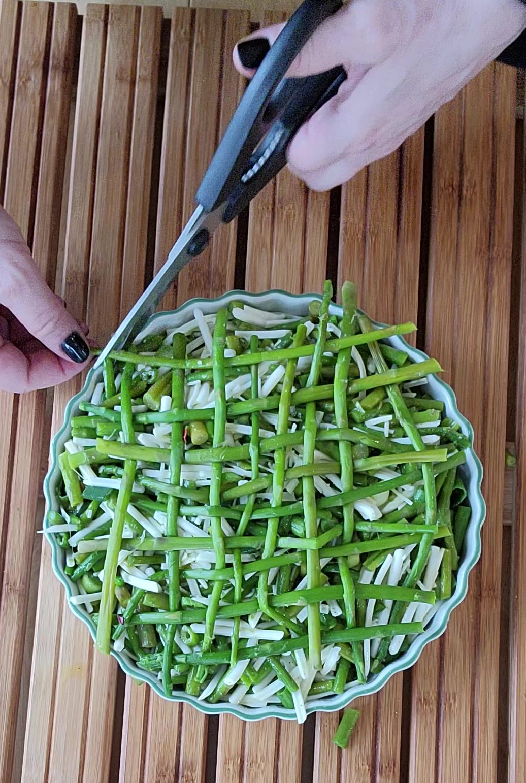 Trim the excess asparagus using a kitchen sheers.
