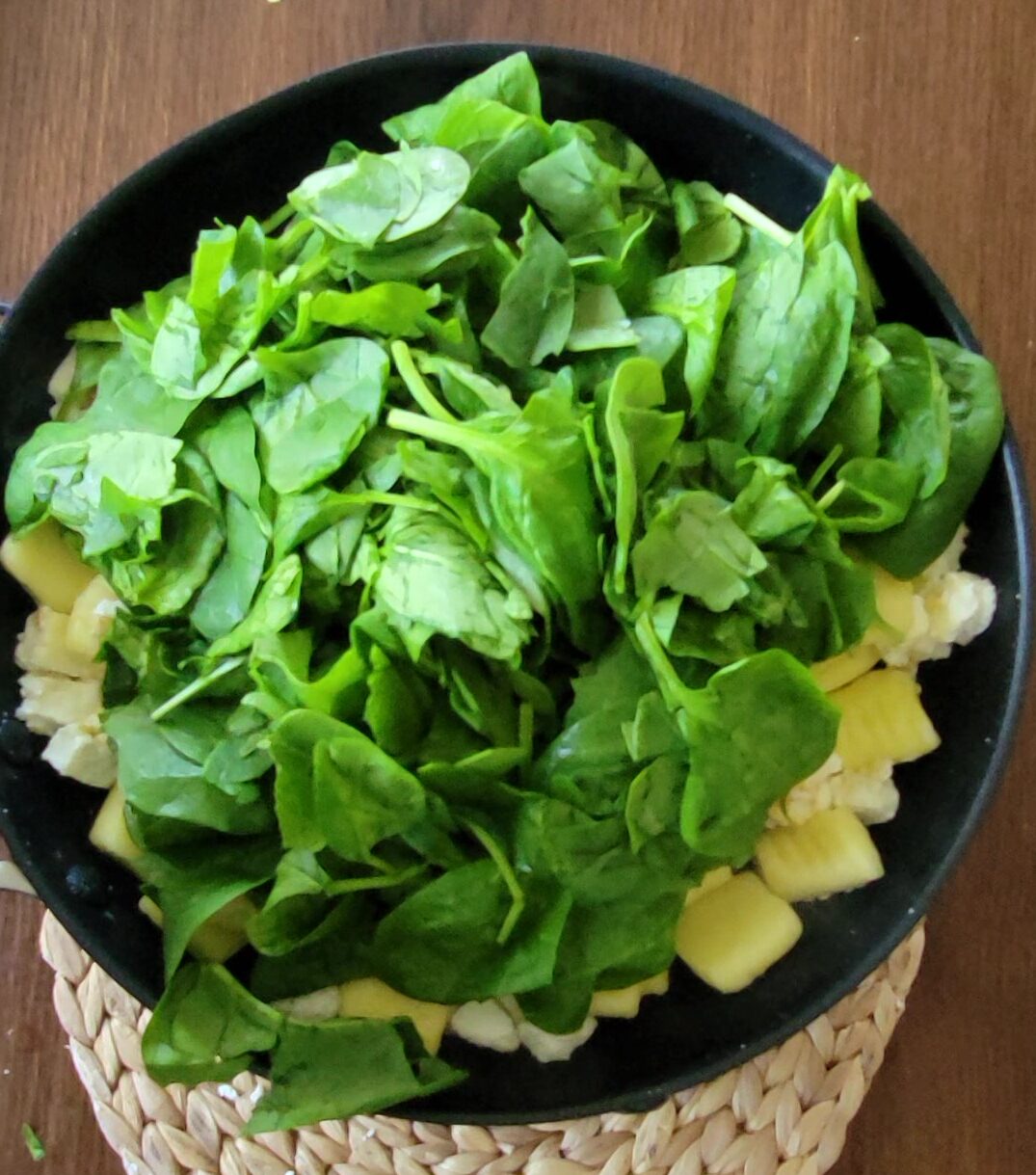 A pile of spinach in the pan