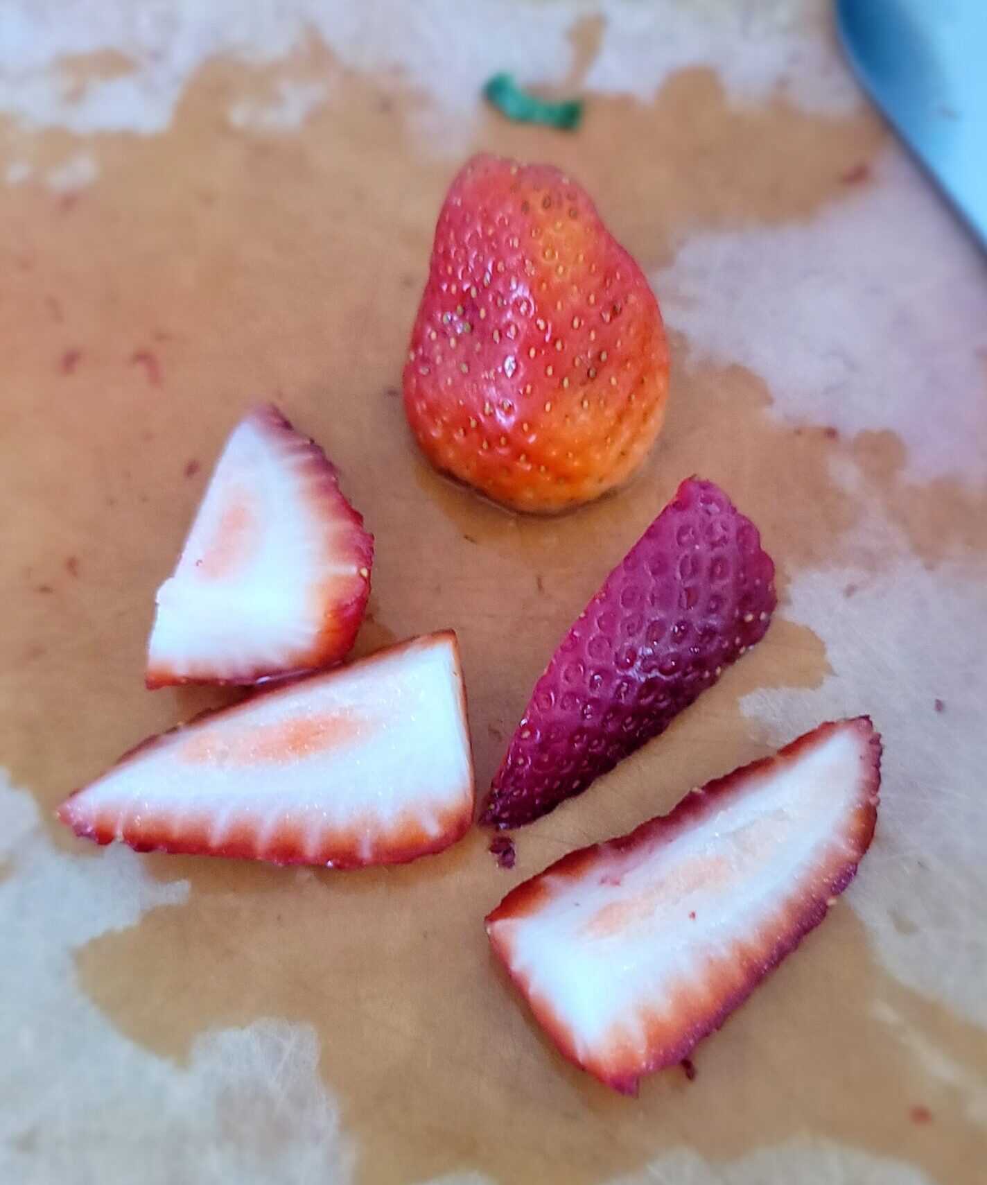 Quartered strawberries for Strawberry Rhubarb Upside Down Cake